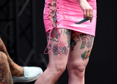 Krakow, Poland - June 11, 2022: Unidentified participant during the contest for the best tattoo at the 15th Tattoofest Convention in Cracow. One of the most prestigious tattoo festivals.