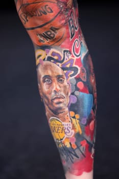 Krakow, Poland - June 12, 2022: Unidentified participant during the contest for the best tattoo at the 15th Tattoofest Convention in Cracow. One of the most prestigious tattoo festivals.