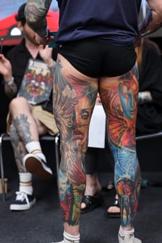 Krakow, Poland - June 12, 2022: Unidentified participant during the contest for the best tattoo at the 15th Tattoofest Convention in Cracow. One of the most prestigious tattoo festivals.