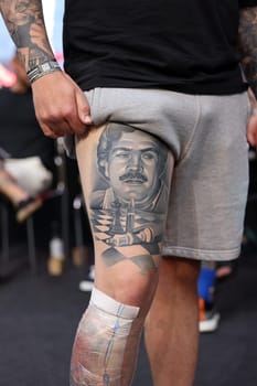 Krakow, Poland - June 12, 2022: Unidentified participant during the contest for the best tattoo at the 15th Tattoofest Convention in Cracow. One of the most prestigious tattoo festivals.
