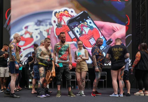 Krakow, Poland - June 12, 2022: Unidentified participants during the contest for the best tattoo at the 15th Tattoofest Convention in Cracow. One of the most prestigious tattoo festivals.
