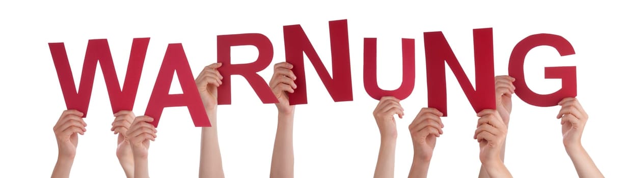 People Or Persons Hands Building German Word Warnung Means Warning. Isolated White Background.