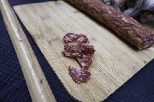 Detail of dried pork sausage in a market, greasy food