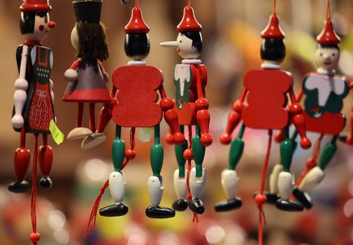 Cracow, Poland - December 19, 2021:Traditional wooden Pinocchio toy sold in souvenir shop in Cracow.