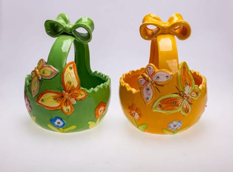 Colorful ceramic Easter decorations with butterfly motifs