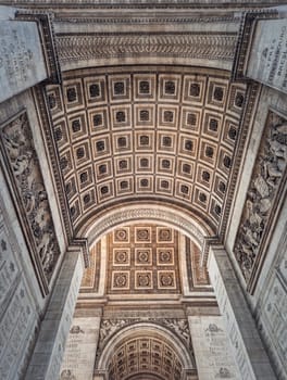 View underneath triumphal Arch in Paris, France. Arc de triomphe, famous historic landmark architecture details