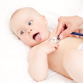 Children's doctor exams infant with stethoscope