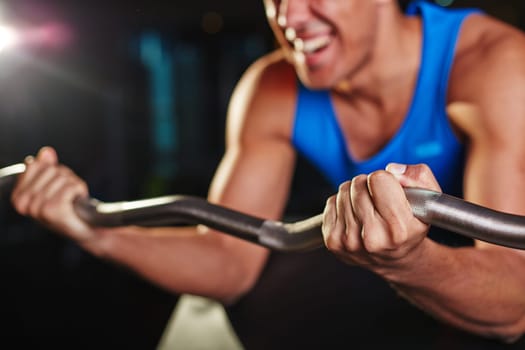 Strong weightlifter training in gym