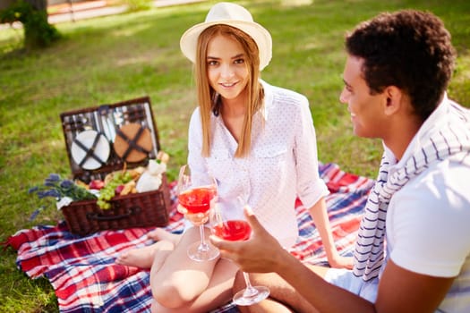 Happy young couple having romantic date in park