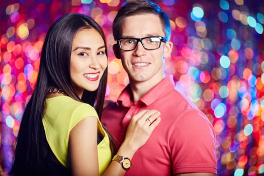 Cheerful couple enjoying party in nightclub