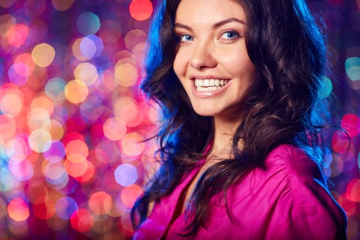 Young brunette looking at camera at party