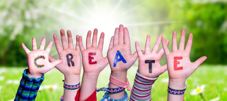 Children Hands Building Colorful English Word Create. Sunny Green Grass Meadow As Background.