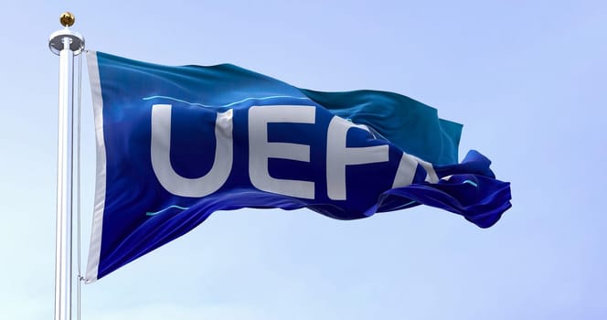 Nyon, CH, April 2023: flag with the UEFA logo waving in the wind. UEFA is the association that manages professional football in Europe. Illustrative editorial 3d illustration render