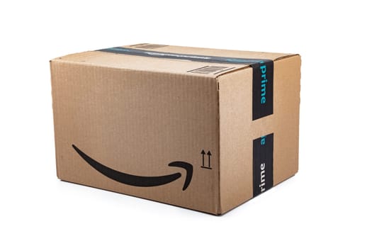 WETZLAR, GERMANY 2022-04-25: Amazon Prime parcel over white background. Prime is a service offered by online retailer Amazon for faster delivery of orders.