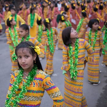 Traditional Dance Girls at the Thingyan Water Festival at the Myanmar New Year in the city centre of Mandalay in Manamar in Southeastasia.