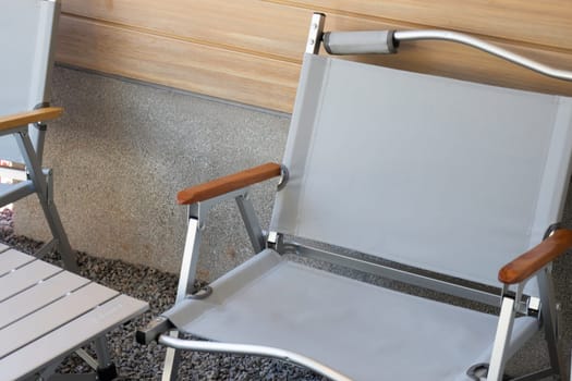 Empty folding camp chair and table, stock photo