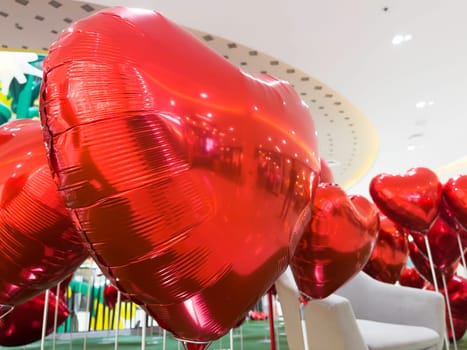 Set of red color heart shaped foil balloons, stock photo