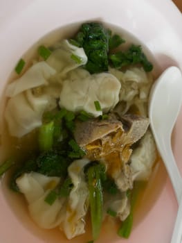 Soup with red roasted pork dumpling, stock photo