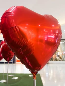 Set of red color heart shaped foil balloons, stock photo