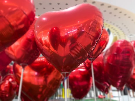 Set of red color heart shaped foil balloons, stock photo
