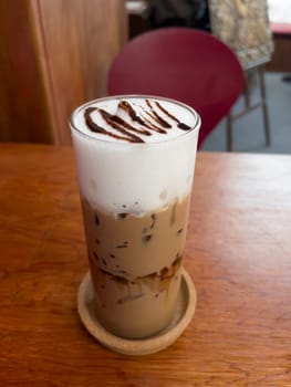 Iced coffee mocha on wooden table, stock photo