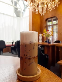 Iced coffee mocha on wooden table, stock photo