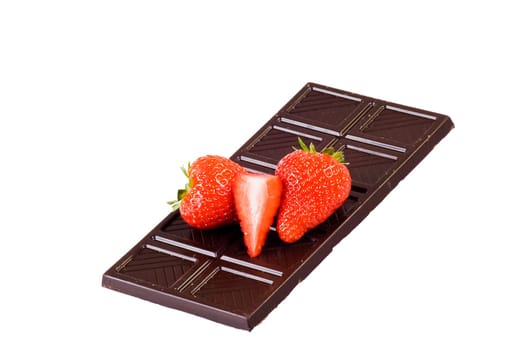 Dark chocolate and strawberries over white background.