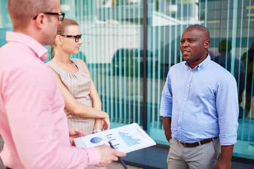 Modern business group having meeting outdoors