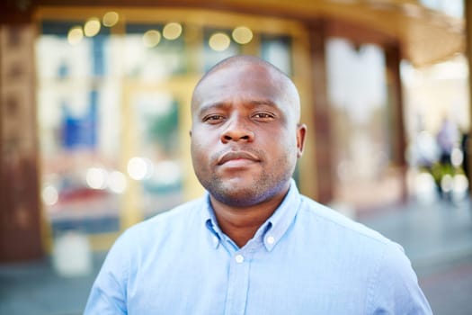Young African-american businessman looking at camera