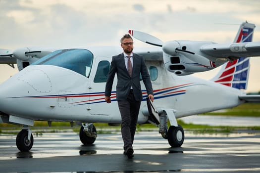 Confident business leader arrived on airplane to meet with foreign partners