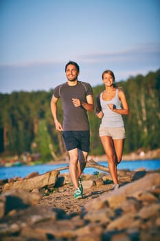 Healthy dates running down sandy beach