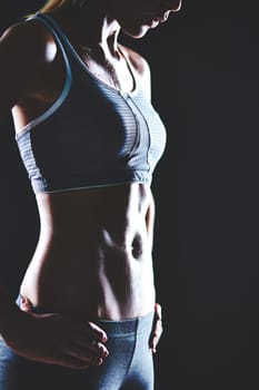 Body of slim female in activewear