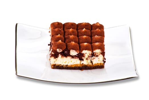 Tiramisu cake on the plate over white background.