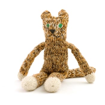 knitted cat sitting on a white