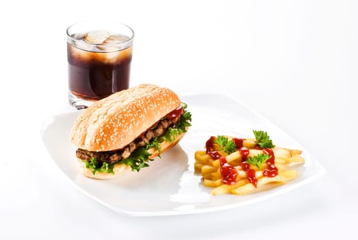 Ribeye steak in sesame seed bun with fries and coke
