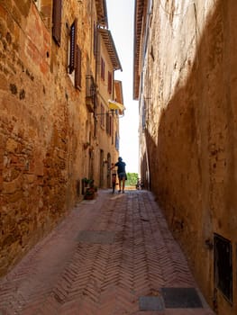Pienza, Italy - Sept 12, 2022: Pienza, a tiny village in the Tuscany, known as the ideal city of the Renaissance and a capital of pecorino cheese. UNESCO World Heritage Site.