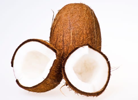 Coconut with halfs on white background - isolated.