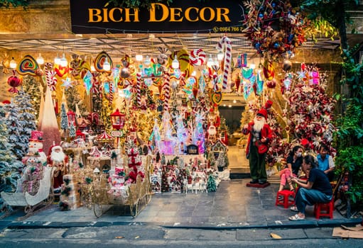 Hanoi, Vietnam, November 14, 2022: Brightly lit display of a Christmas store in French Quarter in Hanoi, Vietnam