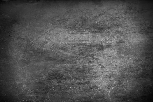 Close up of a black concrete background.