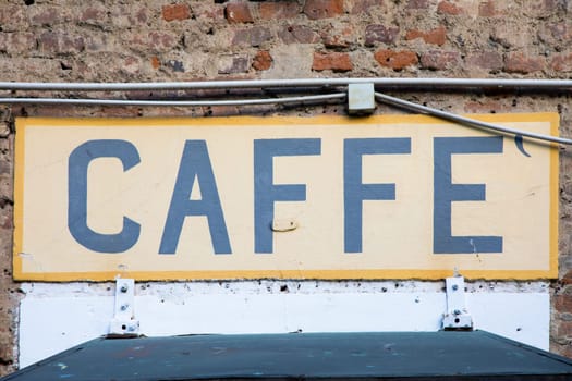 Old vintage coffee sign in Italy - Concept of retro, traditional Caffè design