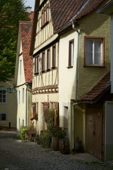 Alley with old historic houses in Rothenburg ob der Tauber in Germany