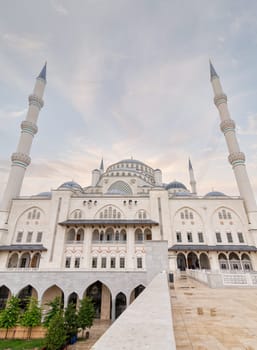 Low angle shot of Grand Camlia Mosque, or Buyuk Camlica Camii, a modern complex for Islamic worship, built in 2019, located in Camlica hill in Uskudar district, Istanbul, Turkey, in a summer day