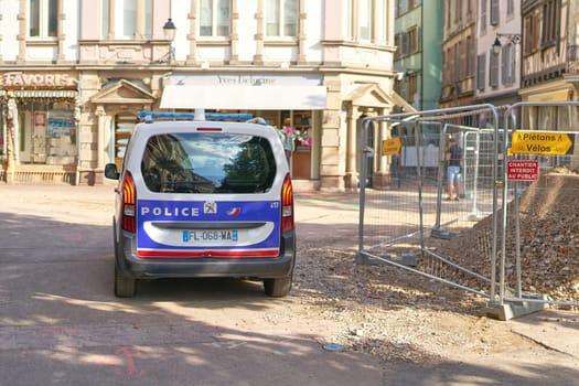 Police car during a control drive at a construction site in the old town of Colmar in France