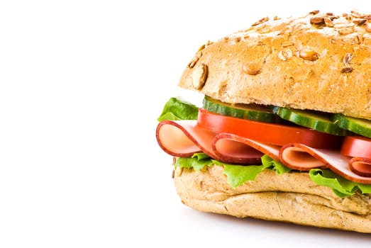 Freshly made sandwich with ham and vegetables over white