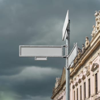 blank white unlabeled sign with text space at a street intersection