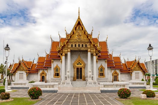 Wat Benchamabophit Dusit Wanaram (This temple is known as the Marble Temple) in Bangkok, blue sky and clouds. One of the most beautiful temples in Thailand Favorite destination in Bangkok. Daytime.