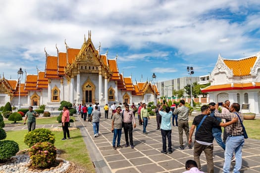 Bangkok, Thailand - Dec 4, 2022 : Many Muslims visiting Wat Benchamabophit Dusitvanaram (also known as the Marble Temple), a major tourist spot in Bangkok It shows that Thailand now welcomes tourists.