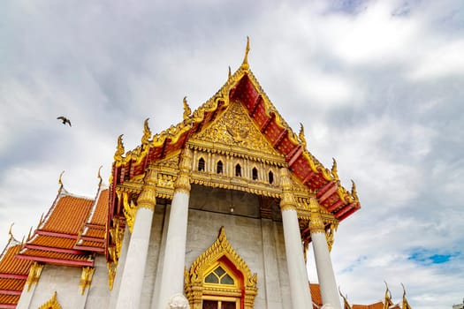 Wat Benchamabophit Dusit Wanaram (This temple is known as the Marble Temple) in Bangkok, blue sky and clouds. One of the most beautiful temples in Thailand Favorite destination in Bangkok. Daytime.