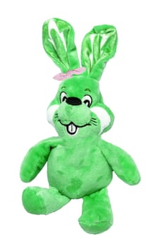 A cute gree plush bunny or rabbit with bow tie isolated on a white background. Easter greeting card decoration element with space for design. Bright plush toy.