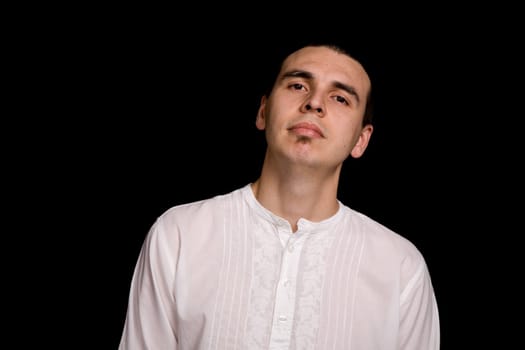 young casual man portrait, on a black background
